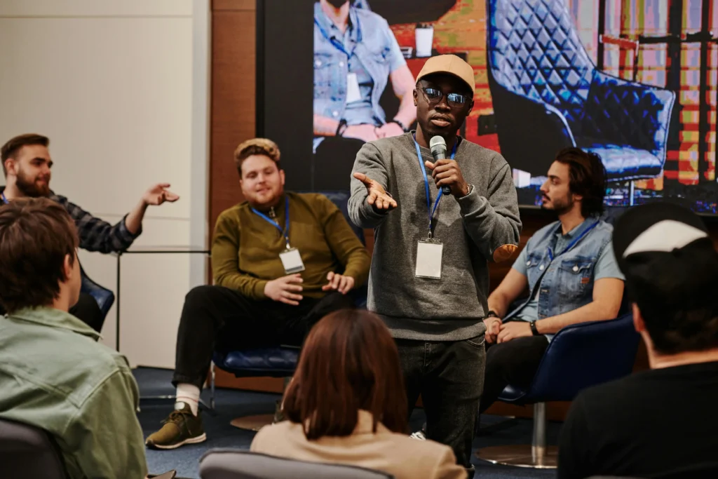 gathering with team mates How to Host a Panel-Style Podcast